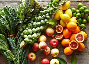 a group of fruits and vegetables on a wood surface Healthy Weight Loss Diets Loughborouogh