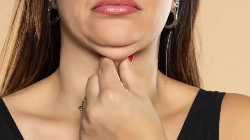 An image of a woman with double chin, sad, worried : Non Surgical Double Chin Removal Treatment in Loughborouogh, UK